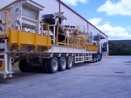 A large truck with a large machine on it.