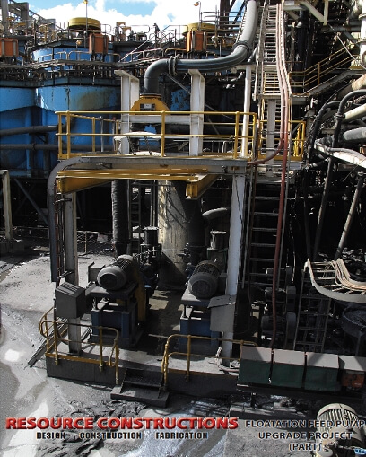 A picture of a factory with a lot of equipment, including belt conveyors.