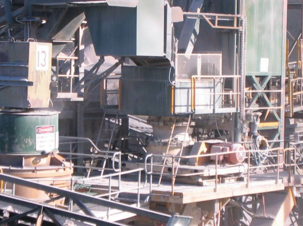 A large industrial plant equipped with belt conveyors and a variety of machinery.