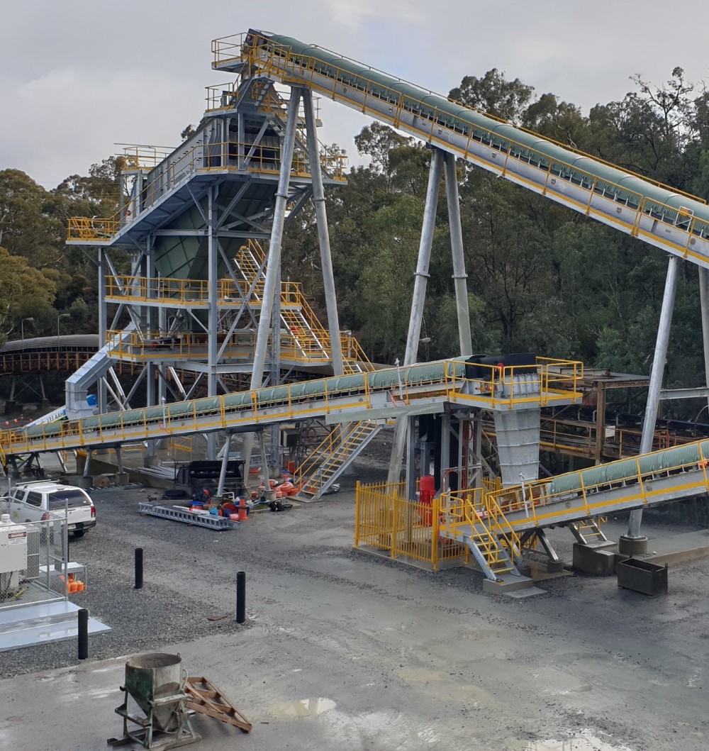 A large conveyor belt at a construction site.