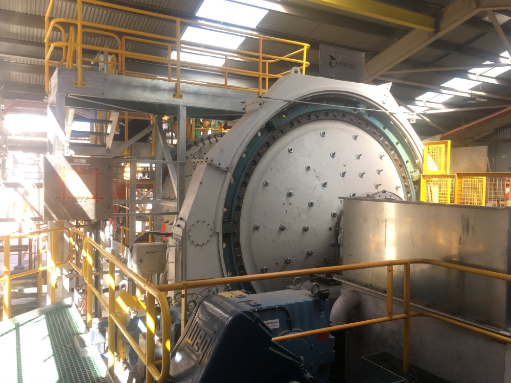 A large metal machine in a factory used in the circuit production process.