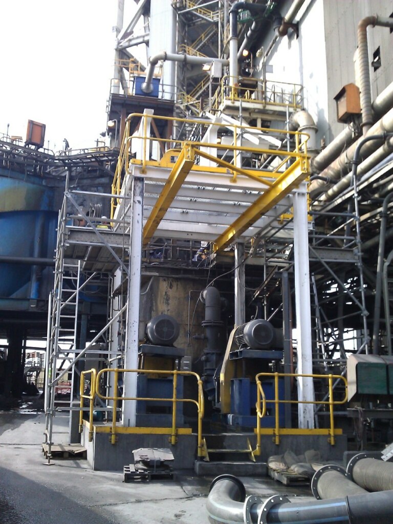 A large industrial plant with a lot of equipment, undergoing a floatation pump system upgrade.