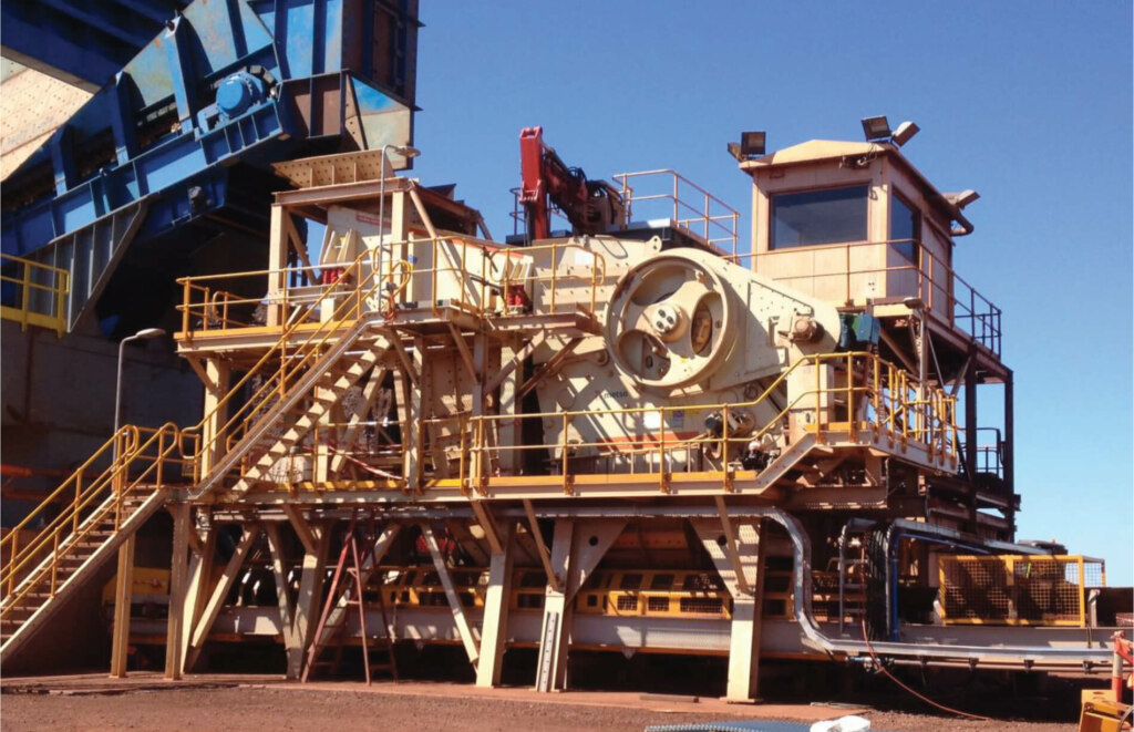 An auto draft machine in front of a large building.